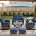 Fauteuils pivotants, canapé 2 places, table et repose-pieds — brun Merrelo™
